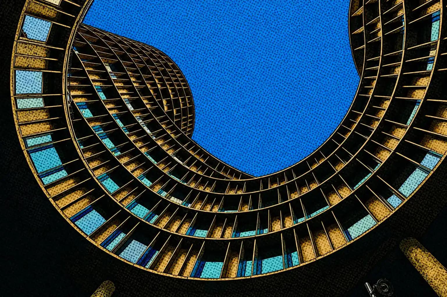 Upward view through the curved facade of a modern European building